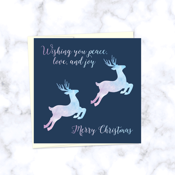Leaping Reindeer Square Folded Christmas Card with Watercolor Textured Reindeer in Pink and Blue - Envelope Included