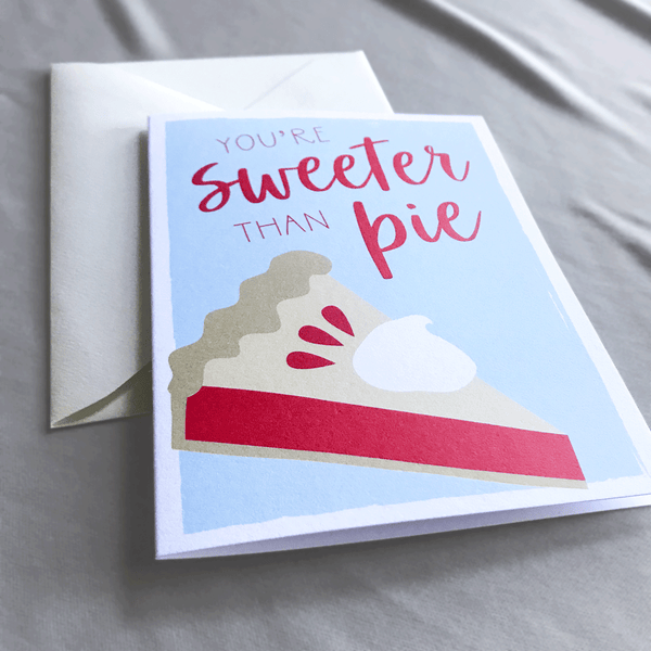 Sweeter than Pie Greeting Card with Illustrated Slice of Pie over Light Blue Background - A2 Folded Blank Card with Cream Envelope - Close up shows texture