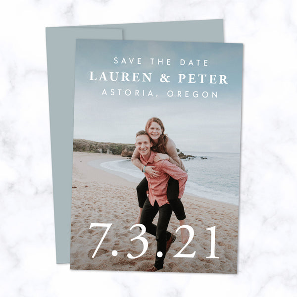 Classic Type Save the Date Cards with Full Frame Photo, Extra Large Date and Minimal Modern Typography shown with Dusty Blue Envelope