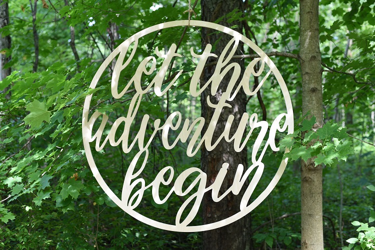 Round Let the Adventure Begin Sign by Feather and Birch